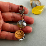 LUCKY PENNY CHARM WITH HANDMADE GLASS BEAD AND SUNFLOWER CHARM