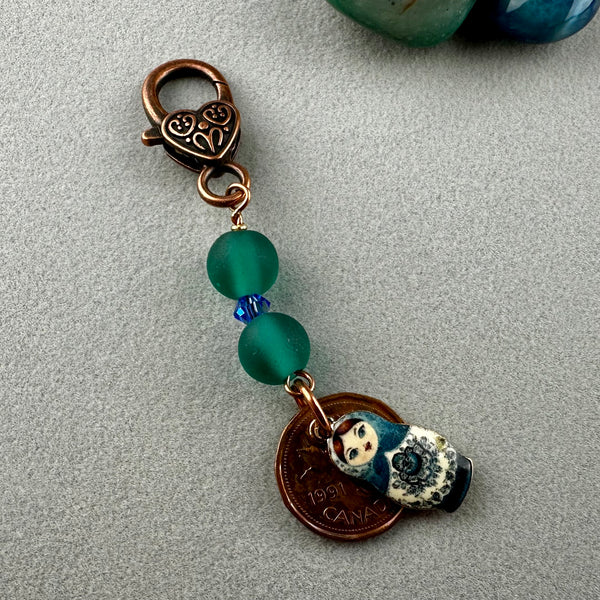 LUCKY PENNY CHARM WITH HANDMADE GLASS BEAD AND BABUSHKA DOLL CHARM