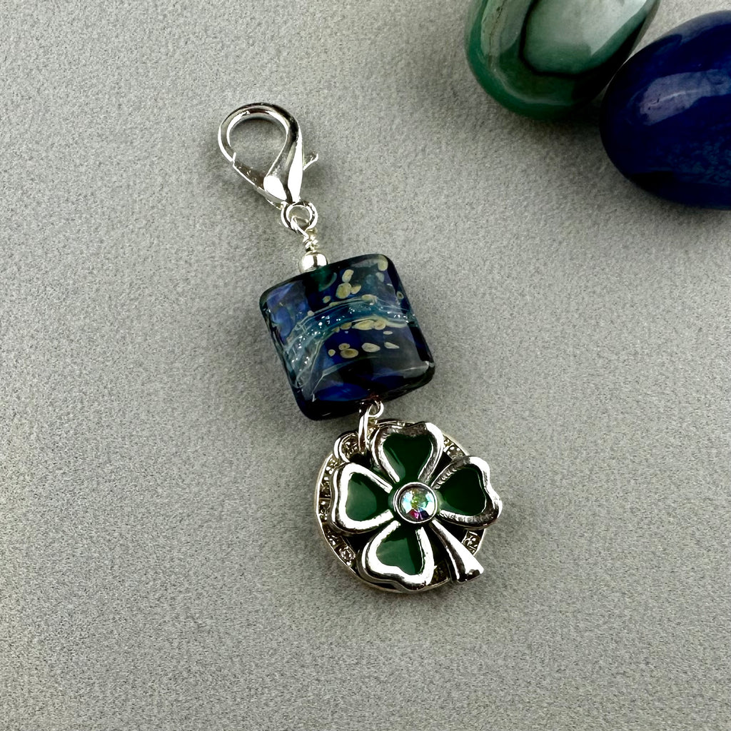 LUCKY SILVER CHARM DROP WITH A HANDMADE GLASS BEAD AND FOUR LEAF CLOVER CHARM