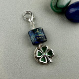 LUCKY SILVER CHARM DROP WITH A HANDMADE GLASS BEAD AND FOUR LEAF CLOVER CHARM