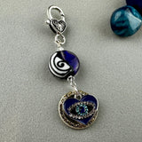 LUCKY SILVER CHARM DROP WITH A HANDMADE GLASS BEAD AND EVIL EYE CHARM