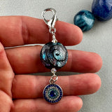 LUCKY SILVER CHARM DROP WITH A HANDMADE GLASS BEAD AND A EVIL EYE CHARM II