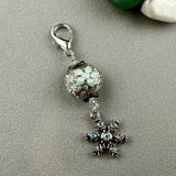 LUCKY SILVER CHARM DROP WITH A HANDMADE GLASS BEAD AND A SPARLY SNOWFLAKE CHARM