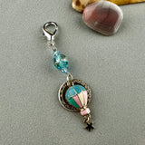 LUCKY SILVER CHARM DROP WITH A HANDMADE GLASS BEAD AND A HOT AIR BALLOON CHARM