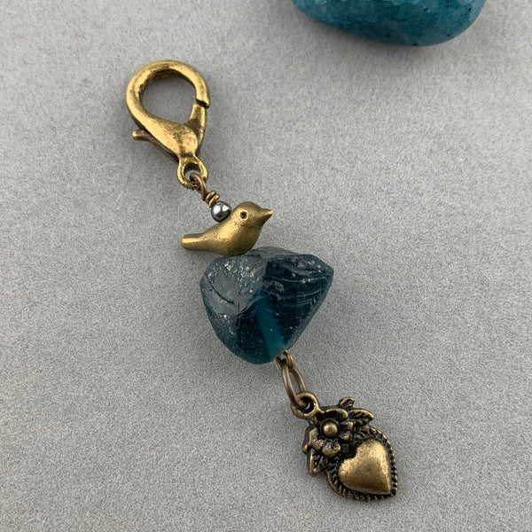 LUCKY CHARM WITH ANCIENT ROMAN GLASS BEAD AND BRONZE BIRD AND HEART CHARMS