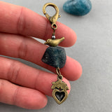 LUCKY CHARM WITH ANCIENT ROMAN GLASS BEAD AND BRONZE BIRD AND HEART CHARMS