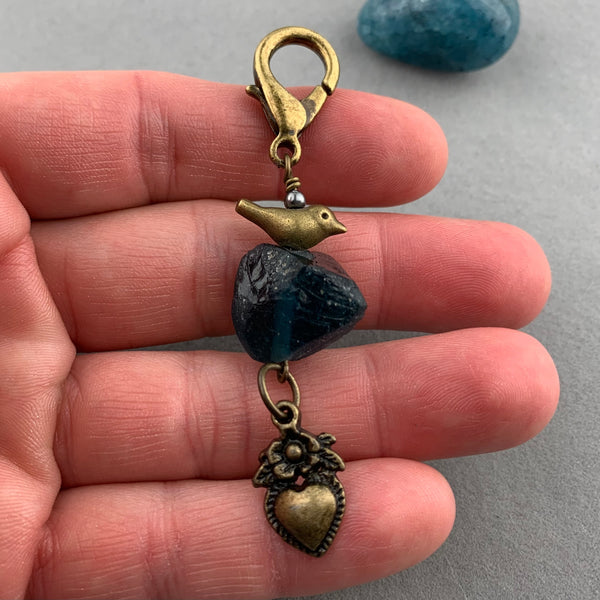 LUCKY CHARM WITH ANCIENT ROMAN GLASS BEAD AND BRONZE BIRD AND HEART CHARMS